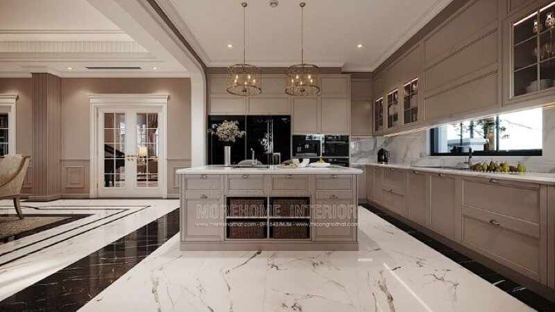 Bàn đảo bếp tân cổ điển ốp đá đẹp sang trọng với thiết kế nhiều hộc tủ cùng các ô mở giúp không gian trở nên linh động, tiện nghi. Mẫu nội thất biệt thự đẹp